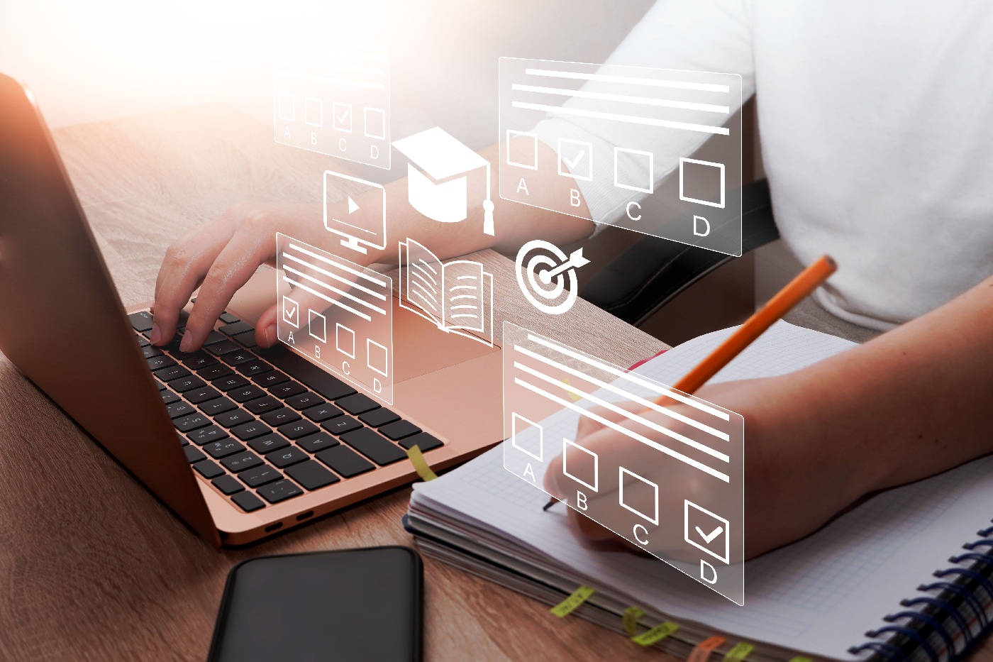 Person typing on a laptop and writing in a notebook with digital education icons overlaid on the image.